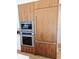This kitchen has a built-in refrigerator and oven with beautiful wood grain cabinets at 2408 Nassau St, Sarasota, FL 34231