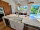 Spacious kitchen island with modern sink, stainless steel appliances, and ample countertop space at 2408 Nassau St, Sarasota, FL 34231