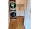 Convenient laundry room features stacked washer/dryer units, utility sink, and built-in storage cabinets at 2408 Nassau St, Sarasota, FL 34231