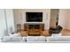 Cozy living room featuring modern furnishings, a large TV, and hardwood floors at 2408 Nassau St, Sarasota, FL 34231
