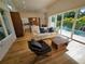 Bright living room with modern furniture, open to the kitchen, and featuring large windows with a pool view at 2408 Nassau St, Sarasota, FL 34231