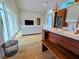 Open-concept living area with wood floors, kitchen island, and access to outdoor spaces at 2408 Nassau St, Sarasota, FL 34231