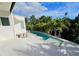 This backyard features a stylish pool, patio with seating, and a beautifully landscaped area at 2408 Nassau St, Sarasota, FL 34231