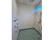 Modern shower featuring mosaic tile flooring, white textured walls, and multi-functional shower heads at 2408 Nassau St, Sarasota, FL 34231