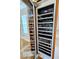Elegant wine storage area with wooden racks and glass door at 2408 Nassau St, Sarasota, FL 34231