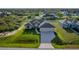 Beautiful house with a well-manicured lawn, paved driveway, and a charming exterior at 9257 King Hill St, Port Charlotte, FL 33981