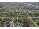 Wide aerial view of a community with diverse home styles and numerous waterways at 9257 King Hill St, Port Charlotte, FL 33981