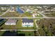 Aerial view of a home with a private pool and a fenced backyard at 9257 King Hill St, Port Charlotte, FL 33981