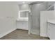 Bright bathroom features a glass enclosed shower and a modern vanity at 9257 King Hill St, Port Charlotte, FL 33981