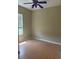 Bedroom with standard closet doors, neutral walls, awaiting personalization at 1452 Crazy Horse Dr, Lutz, FL 33559