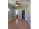 Comfortable bedroom with ceiling fan and doorways leading to additional rooms in the home at 1452 Crazy Horse Dr, Lutz, FL 33559