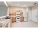 Spacious kitchen with wood cabinets and white appliances at 26622 Castleview Way, Wesley Chapel, FL 33544
