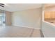 Neutral living room with tile floors, a ceiling fan, and sliding glass doors at 26622 Castleview Way, Wesley Chapel, FL 33544