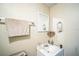 Cozy bathroom with a white sink and vanity, accented by a framed mirror at 1711 E Sewaha St, Tampa, FL 33612
