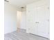 Bright Bedroom with double door closet featuring ceiling fan, and vinyl flooring at 23461 Wickens Ave, Port Charlotte, FL 33980