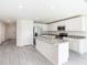 Bright kitchen featuring white cabinets, stainless steel appliances, and granite countertops at 23461 Wickens Ave, Port Charlotte, FL 33980