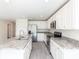 Spacious kitchen with granite countertops, stainless steel appliances, and plenty of cabinet space at 23461 Wickens Ave, Port Charlotte, FL 33980