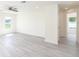 Bright Living room featuring a ceiling fan, with large window and vinyl flooring at 23461 Wickens Ave, Port Charlotte, FL 33980