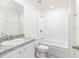 The bathroom features a shower-tub combo, granite counters, and ample lighting at 3124 N Chamberlain Blvd, North Port, FL 34286