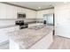 This kitchen offers granite countertops, stainless steel appliances, an island, and plenty of storage at 3124 N Chamberlain Blvd, North Port, FL 34286