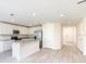 Spacious living area features modern flooring, recessed lighting, and neutral wall paint at 3124 N Chamberlain Blvd, North Port, FL 34286