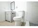 Well-lit bathroom with modern fixtures, a sleek vanity, and tiled shower at 5907 Sussex Ct, Tampa, FL 33615