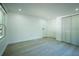Bright bedroom features wood-look floors, closet, and a crisp, neutral color palette at 5907 Sussex Ct, Tampa, FL 33615