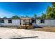 Charming single-story home featuring a covered front porch and white siding at 5907 Sussex Ct, Tampa, FL 33615