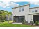 Beautiful home backyard featuring a screened lanai and a well maintained lawn at 8661 Daydream St, Sarasota, FL 34238