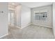 This bedroom features neutral walls, carpet, and a window at 8661 Daydream St, Sarasota, FL 34238