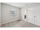 This bedroom features carpet, a window, and a closet at 8661 Daydream St, Sarasota, FL 34238