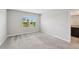 This spacious bedroom features neutral decor, comfortable carpet, and a window view at 8661 Daydream St, Sarasota, FL 34238