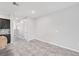 Large open dining area with tile floors, neutral walls, and easy access to the kitchen and stairs at 8661 Daydream St, Sarasota, FL 34238