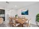 Dining area featuring a wood table, seating for six, and modern decor for elegant meals at 8661 Daydream St, Sarasota, FL 34238