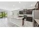 Well-equipped kitchen featuring an island, stainless steel appliances, and dark wood cabinetry at 8661 Daydream St, Sarasota, FL 34238