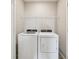 This laundry room features a washer and dryer at 8661 Daydream St, Sarasota, FL 34238