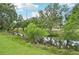 Picturesque community pond surrounded by lush greenery and trees at 8661 Daydream St, Sarasota, FL 34238