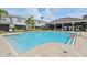 Gorgeous community pool and surrounding amenities with lounge chairs and shade at 8661 Daydream St, Sarasota, FL 34238