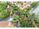 Overhead view of a residential area with townhouses, trees, and parking areas at 5641 Ashley Oaks Dr # 39, Tampa, FL 33617