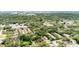 A lush, green residential area featuring well-maintained townhomes nestled among mature trees and landscaping at 5641 Ashley Oaks Dr # 39, Tampa, FL 33617