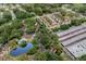 Aerial view of community showing buildings, storage, pool, and a lake at 5641 Ashley Oaks Dr # 39, Tampa, FL 33617