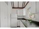 Functional kitchen space with white cabinets, sleek countertops, and a sunny window at 5641 Ashley Oaks Dr # 39, Tampa, FL 33617