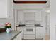 Kitchen featuring white cabinets, countertops, and appliances at 5641 Ashley Oaks Dr # 39, Tampa, FL 33617