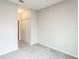 Neutrally decorated bedroom showing closet and access to the hall at 6204 Camino Dr, Apollo Beach, FL 33572