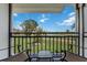 Inviting balcony with chairs overlooking the scenic golf course at 6210 Sun Blvd # 206, St Petersburg, FL 33715