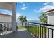 Balcony with black metal railing featuring views of the waterway, beach and trees at 6210 Sun Blvd # 206, St Petersburg, FL 33715