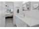 Bright bathroom featuring a modern vanity with white countertop and a glimpse into an airy bedroom at 6210 Sun Blvd # 206, St Petersburg, FL 33715