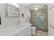 Bathroom featuring a glass-enclosed shower, vanity with sink, and modern fixtures at 6210 Sun Blvd # 206, St Petersburg, FL 33715