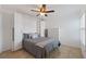 Stylish bedroom featuring a Murphy bed, ceiling fan, and neutral color palette at 6210 Sun Blvd # 206, St Petersburg, FL 33715