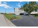 Exterior view of a well-maintained condominium complex with lush landscaping at 6210 Sun Blvd # 206, St Petersburg, FL 33715